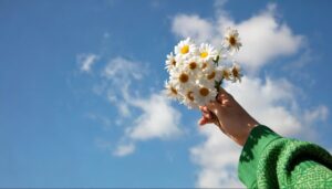 hand hold flowers hope